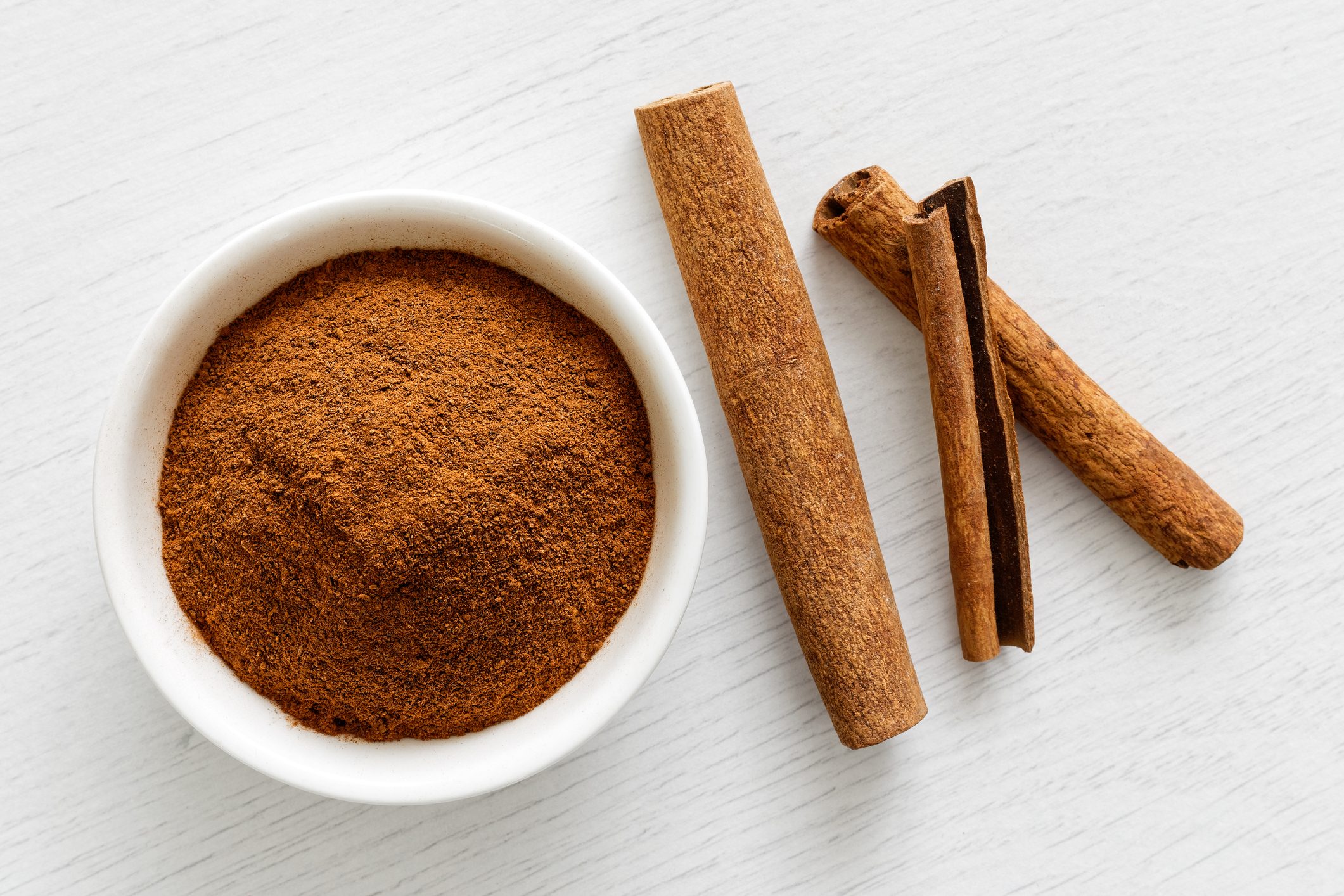 ground cinnamon and cinnamon sticks from above