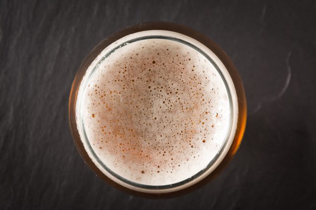 Glass beer on stone background with copy space. wallpaper