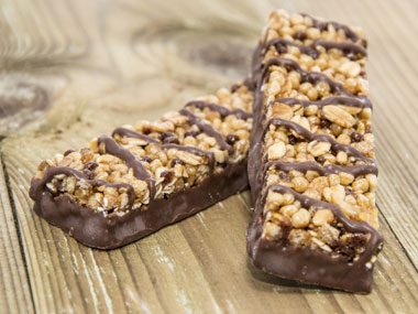 chocolate chip granola bars with drizzle of chocolate on top