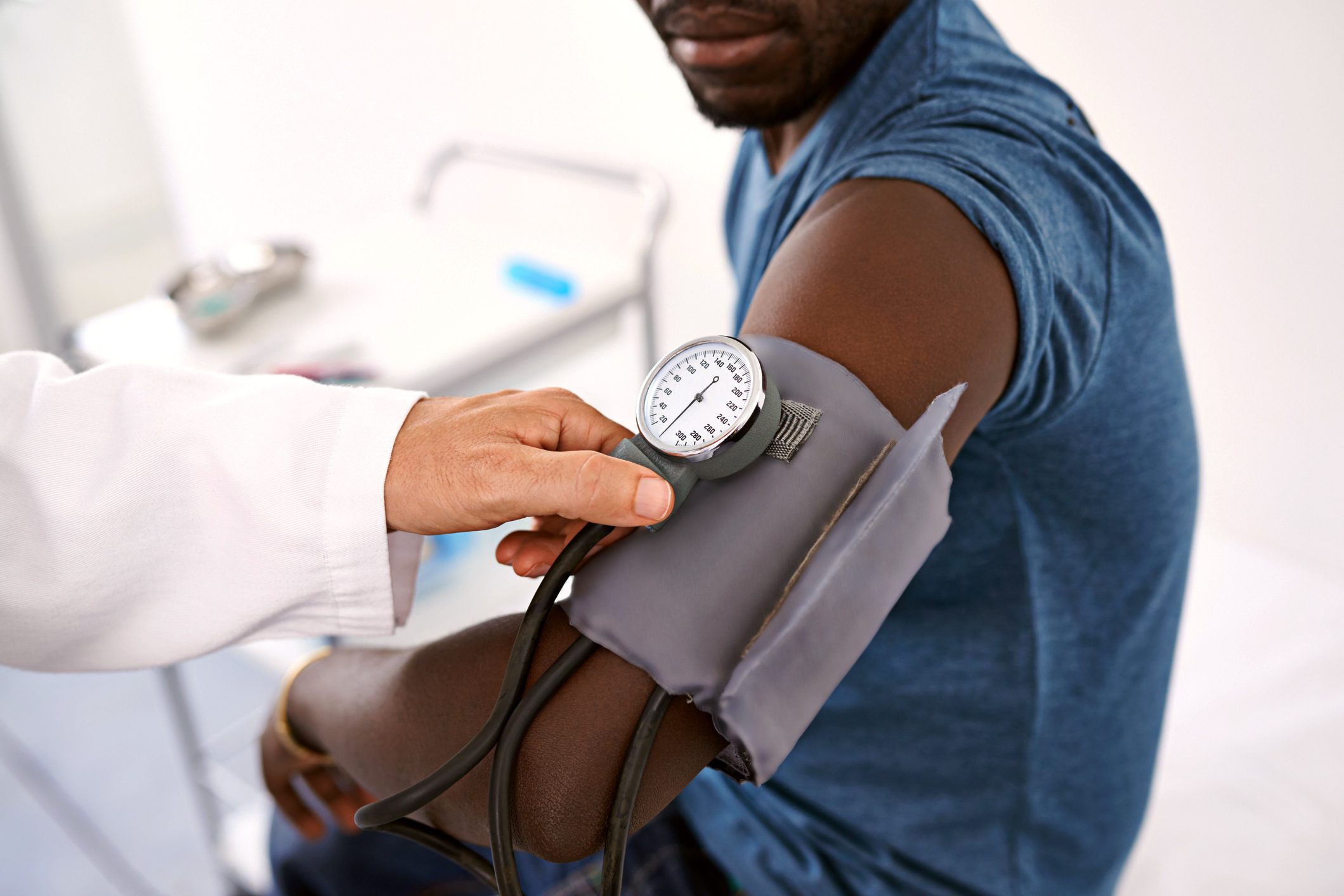 man getting his blood pressure taken