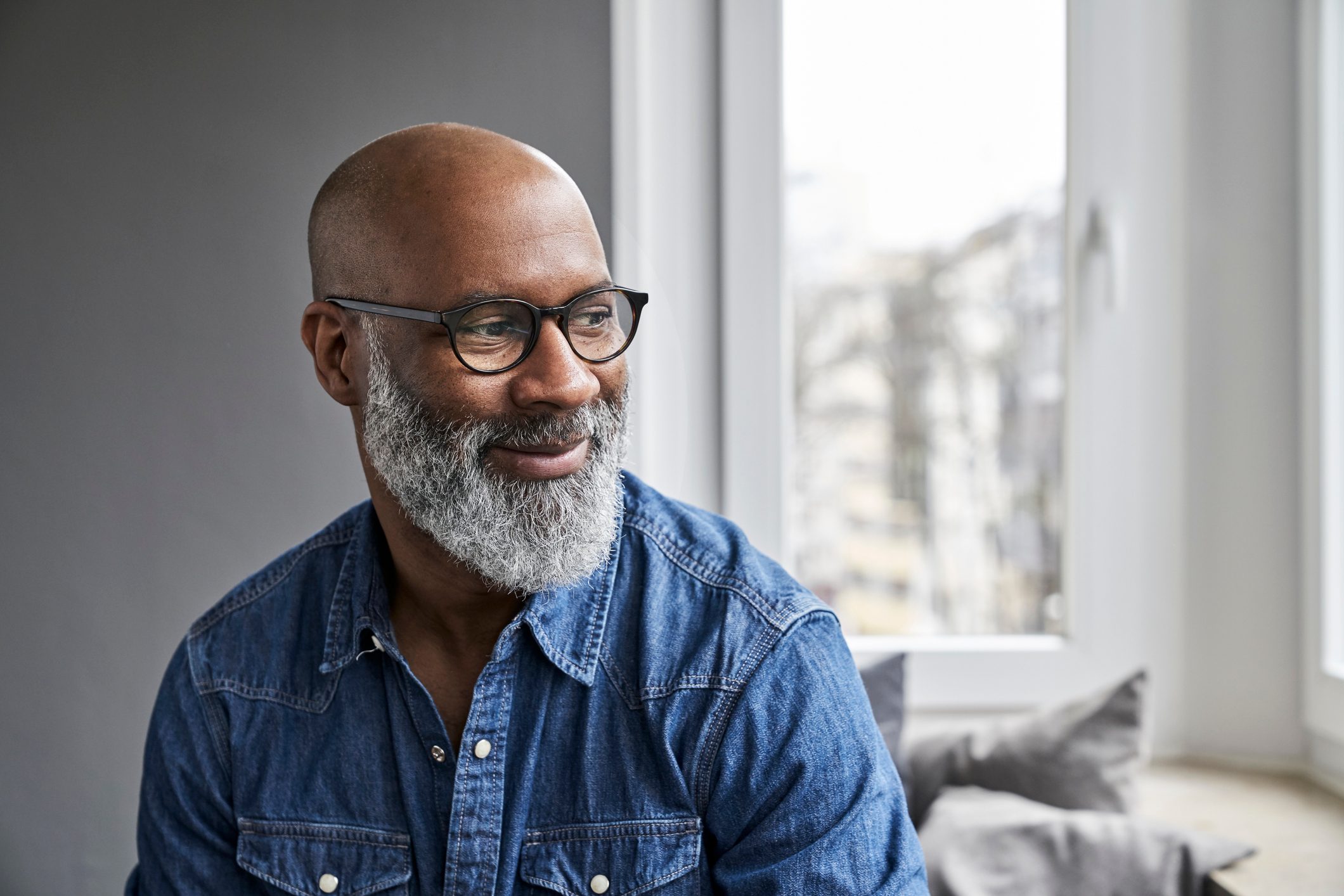 mature man smiling and thinking