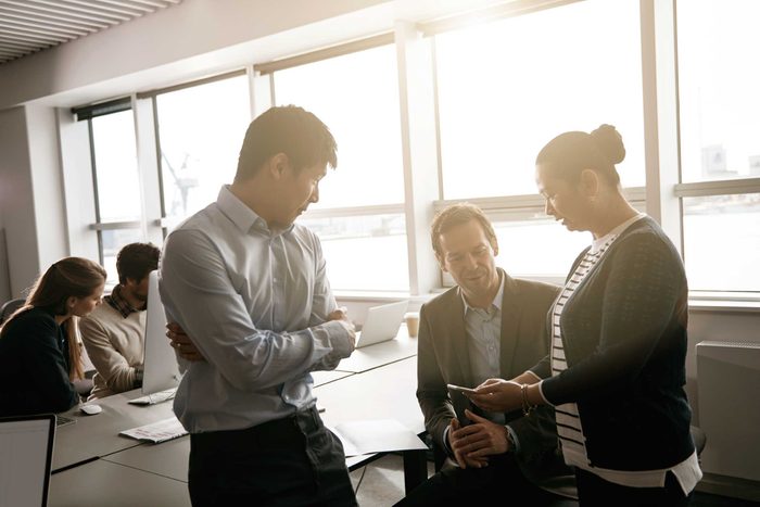 co-workers standing around together