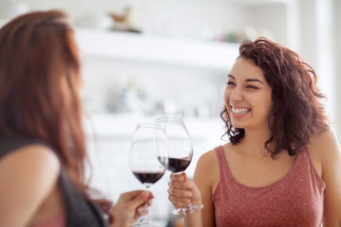 two women toasting with wine