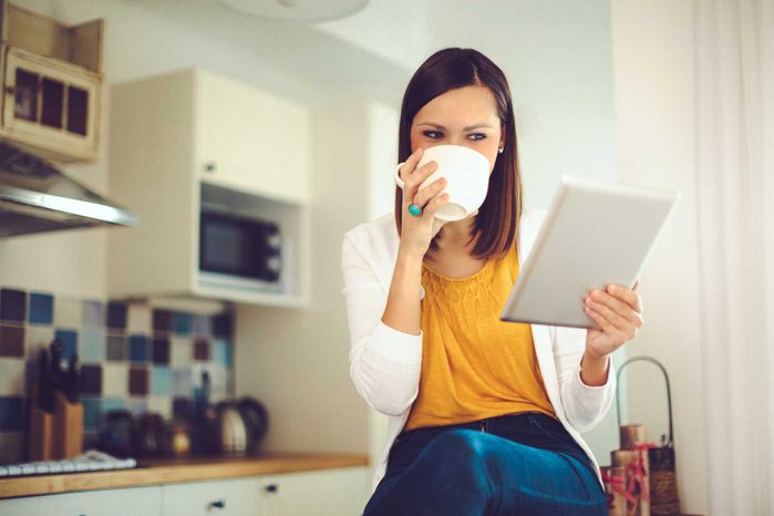 woman drinking cup of coffee
