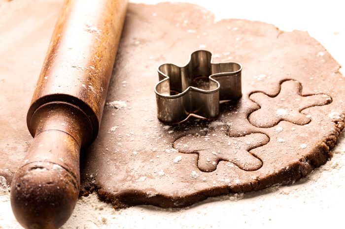 Rolling pin on gingerbread cookie dough.