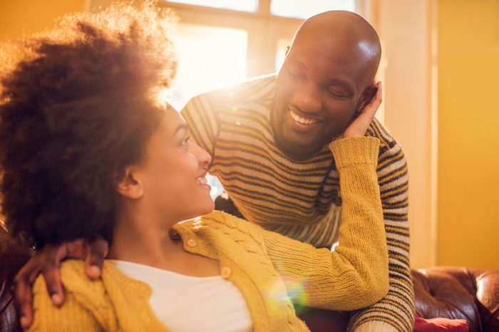 black couple holding and looking at each other with affection