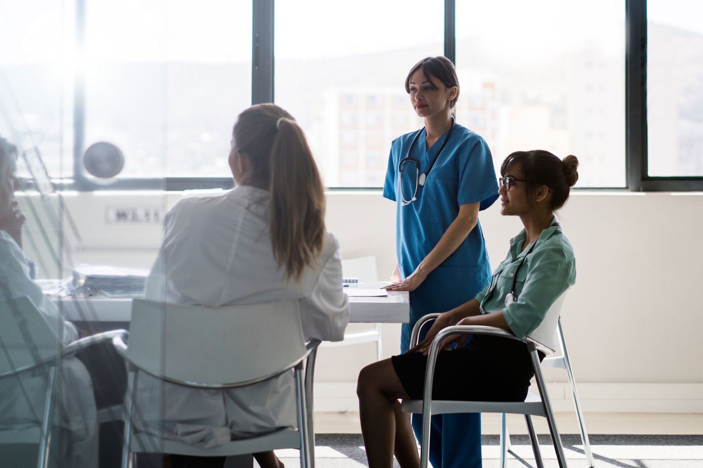 hospital staff meeting around a table