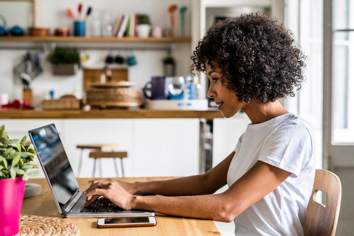 woman using laptop at home