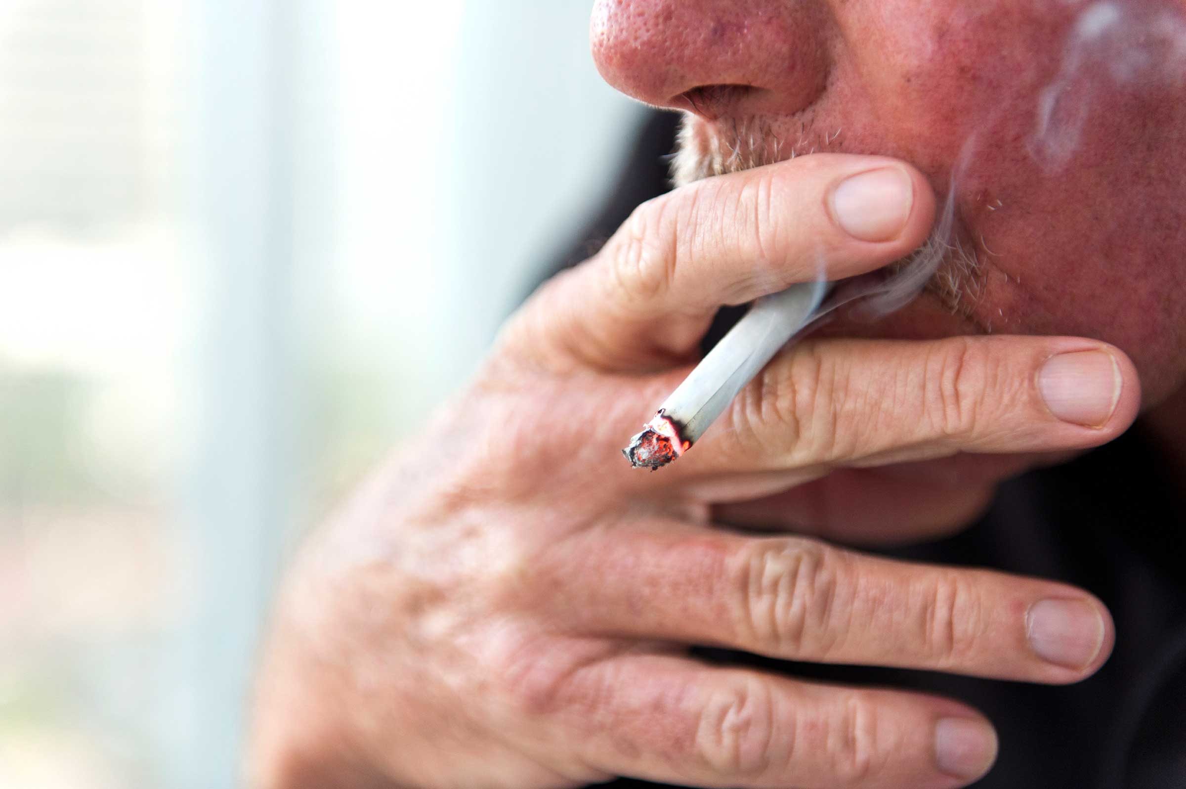 man smoking cigarette