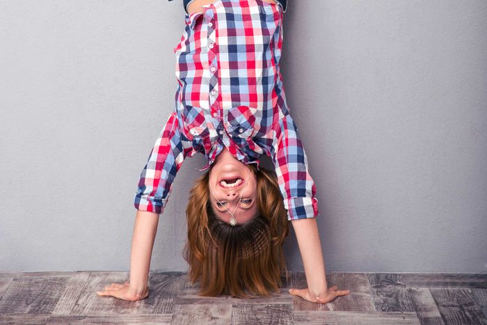 woman doing a handstand