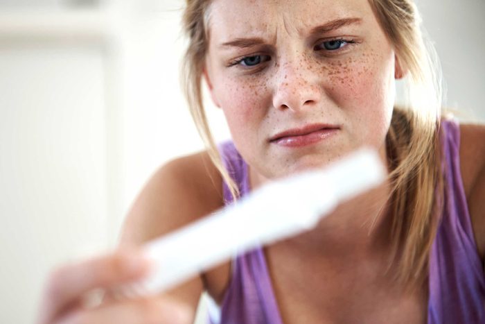 woman with pregnancy test