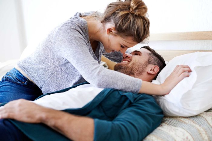 man and woman in bed