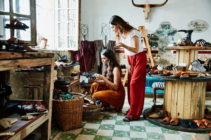 woman shopping for sandals