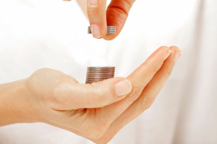 stack of coins in hand