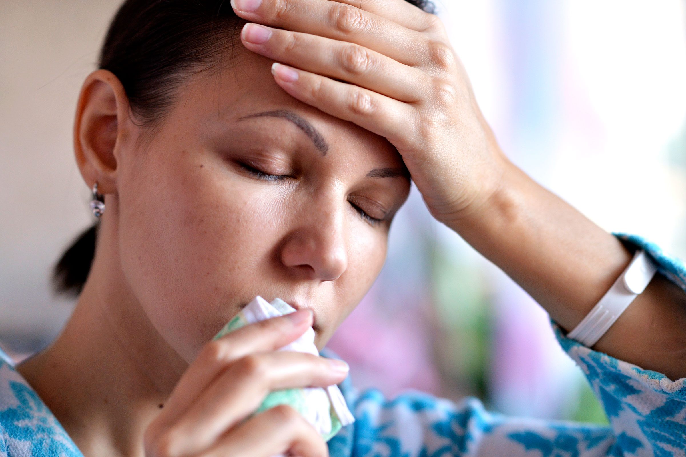 woman covering mouth