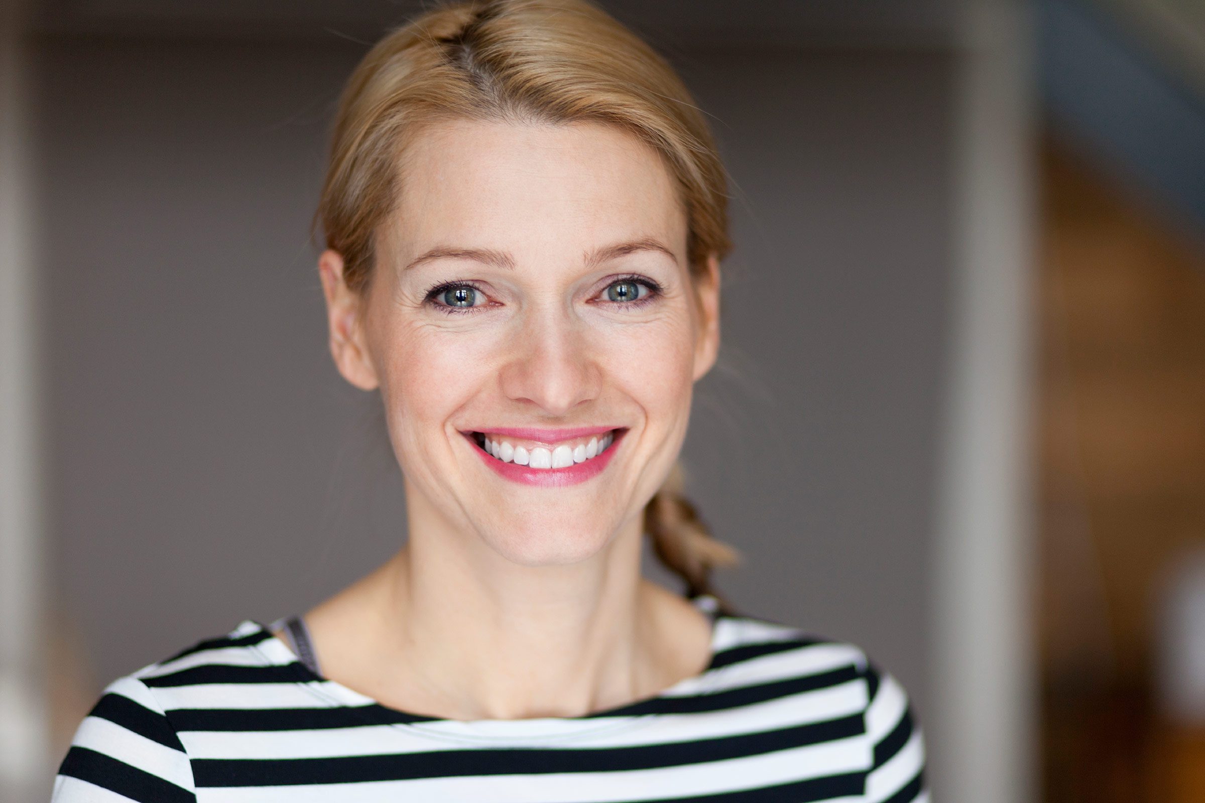 40-ish woman with blonde hair, smiling