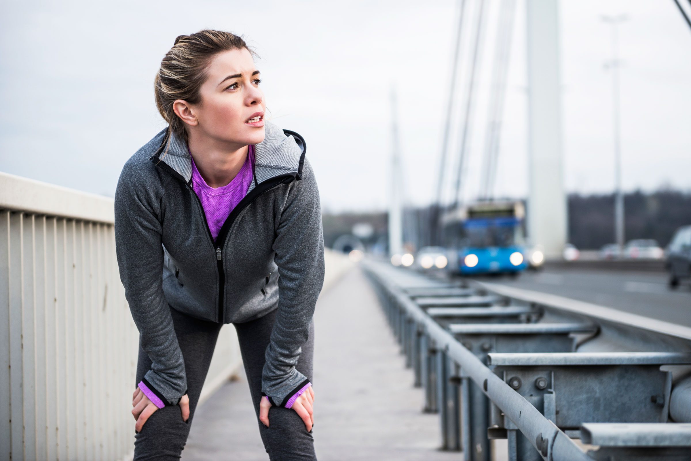 woman stopping to catch breath