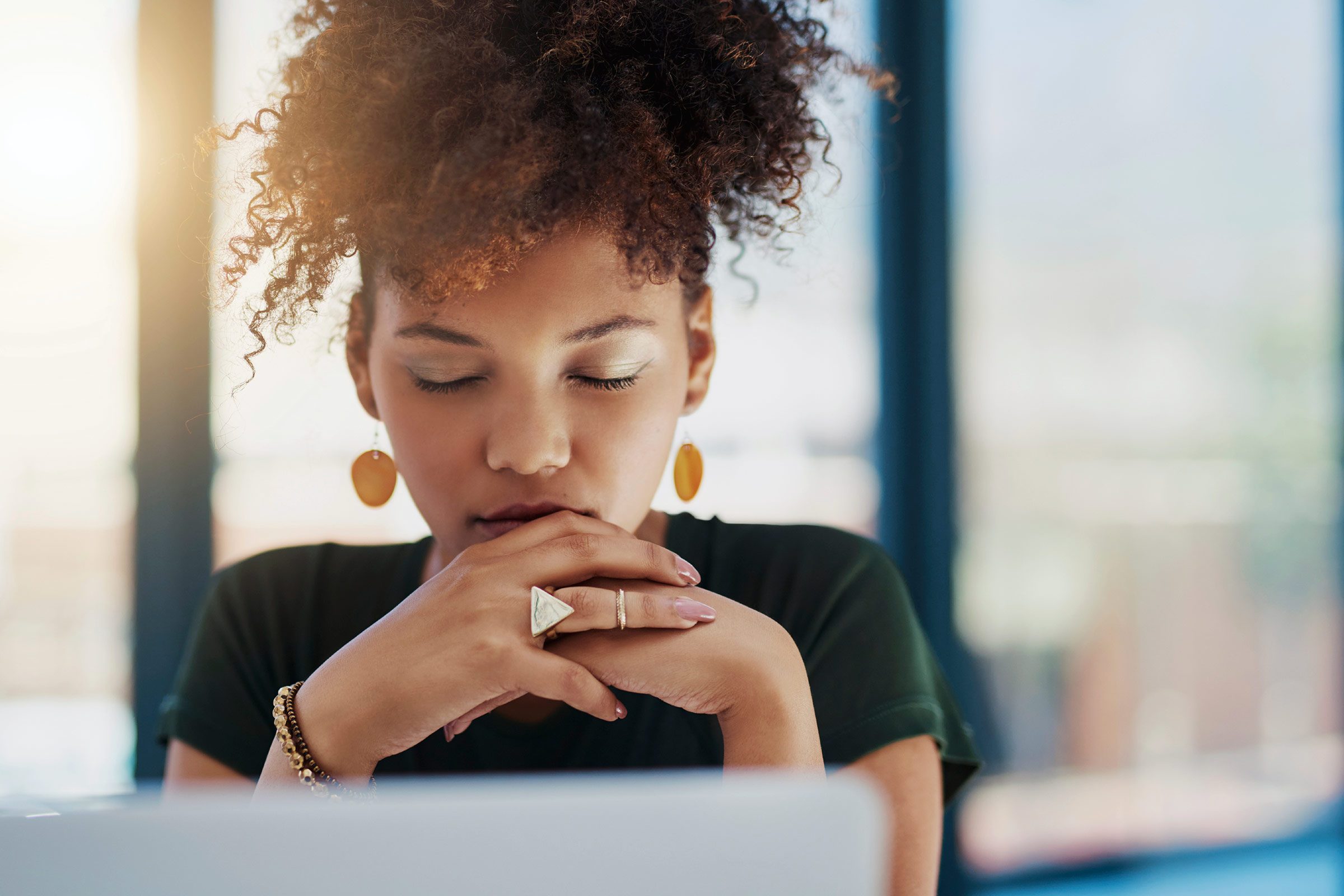 African American woman looking at a computer screen