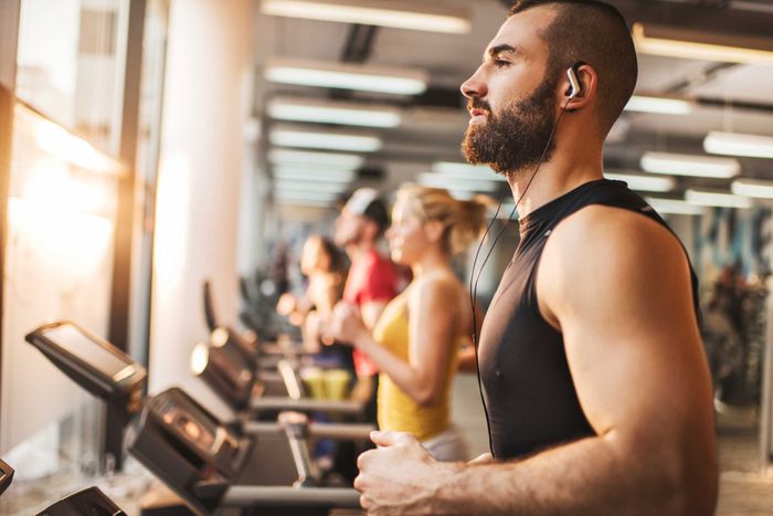 man running on treadmill at gym