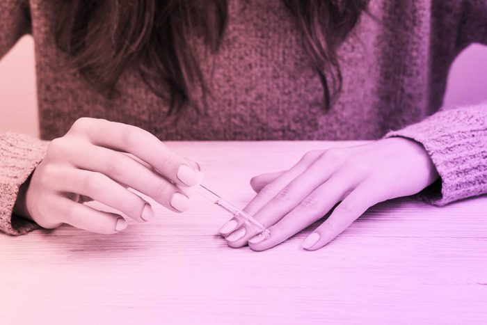 person paining nails