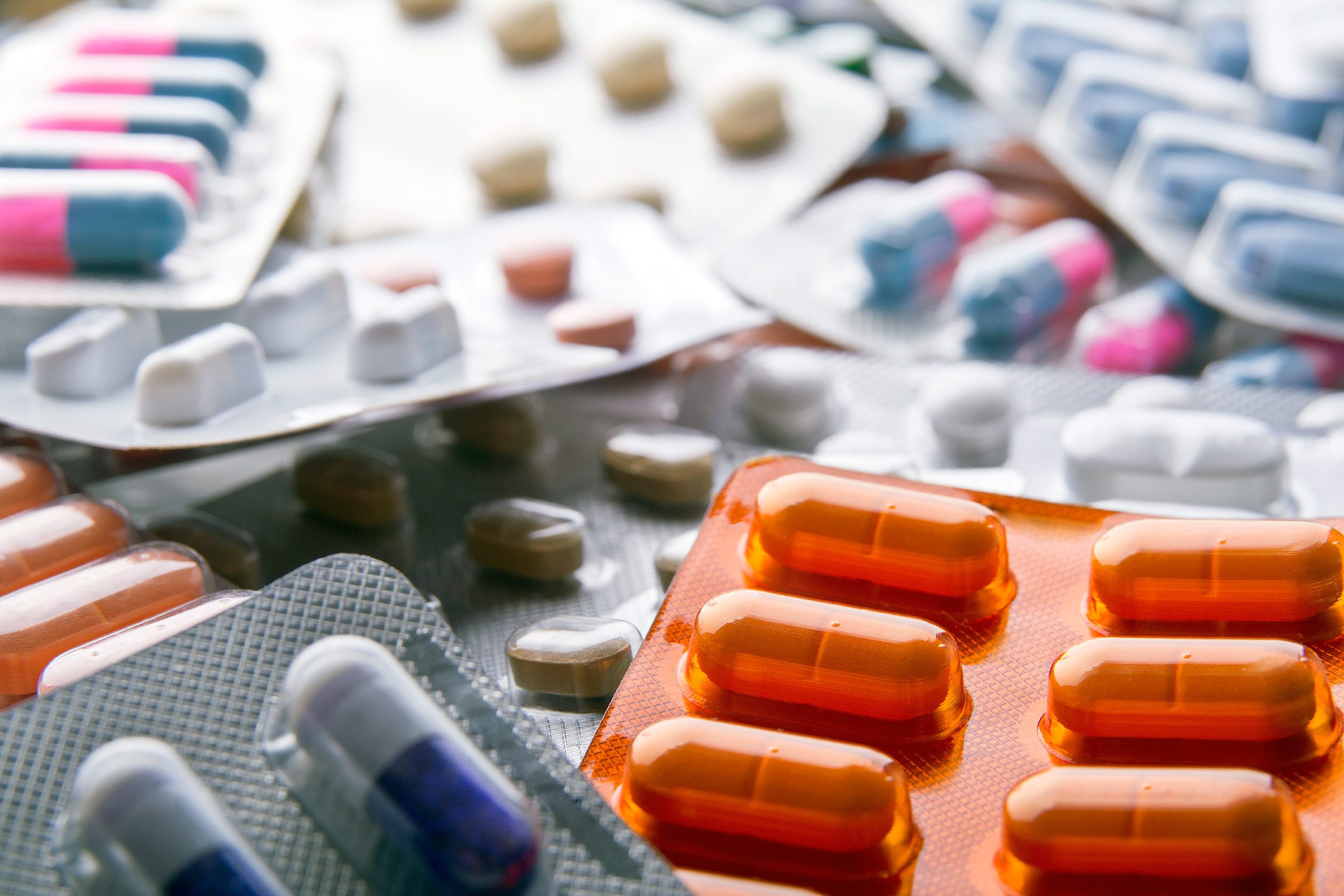 a variety of prescription pills in blister packaging