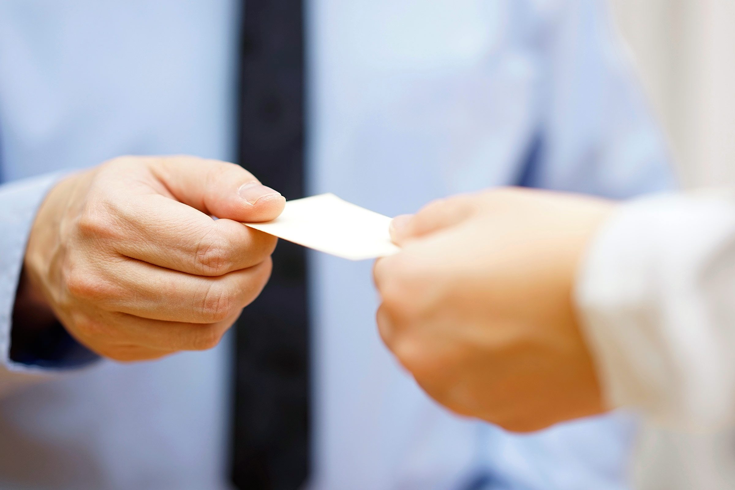 doctor handing a patient a note