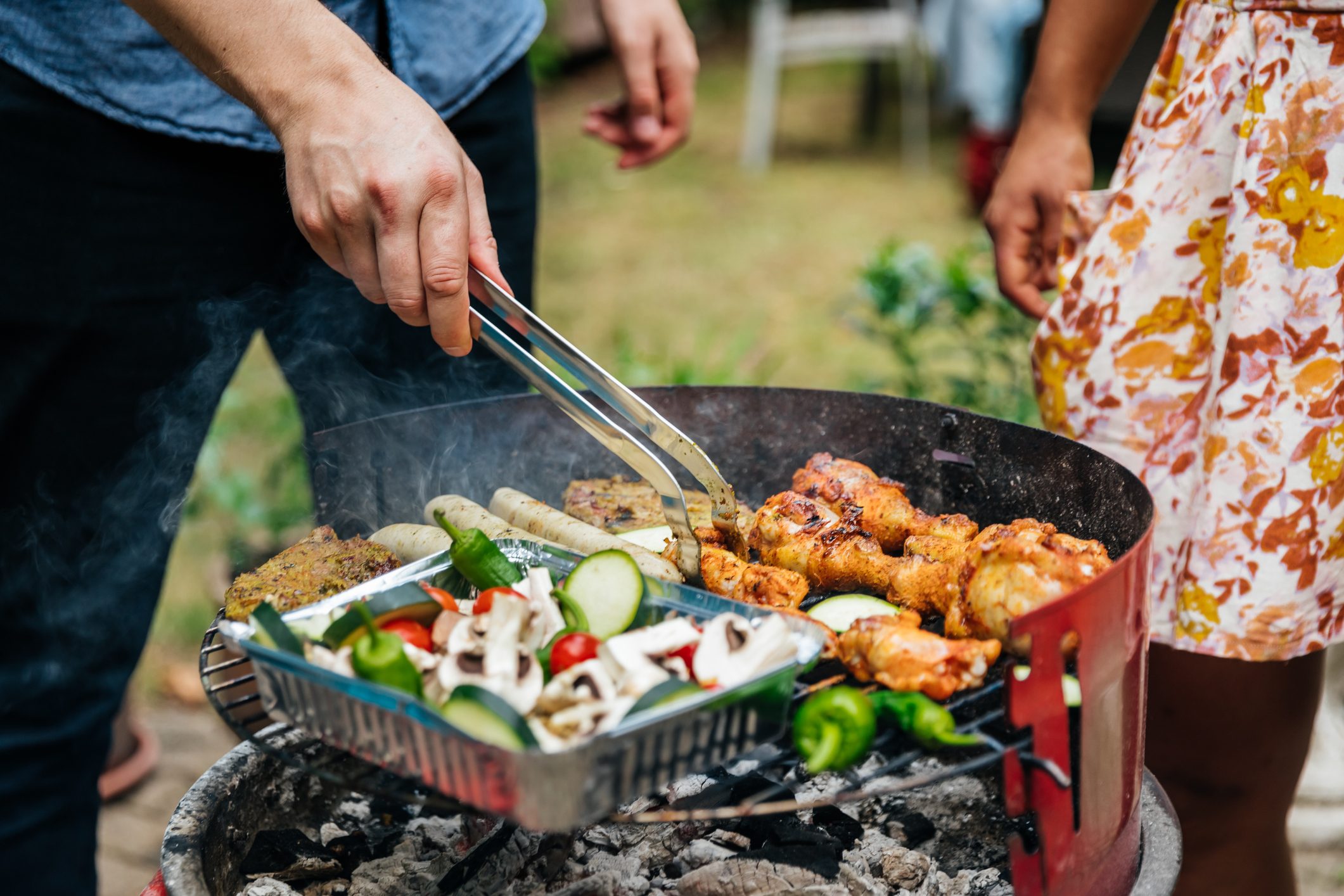 close up of man grilling food