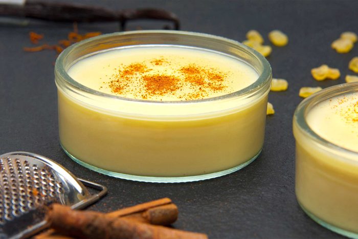 ramekins of custard sprinkled with cinnamon