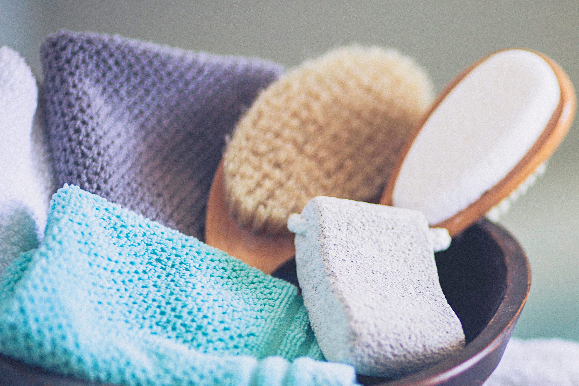 basket with brushes, pumice, and washcloths