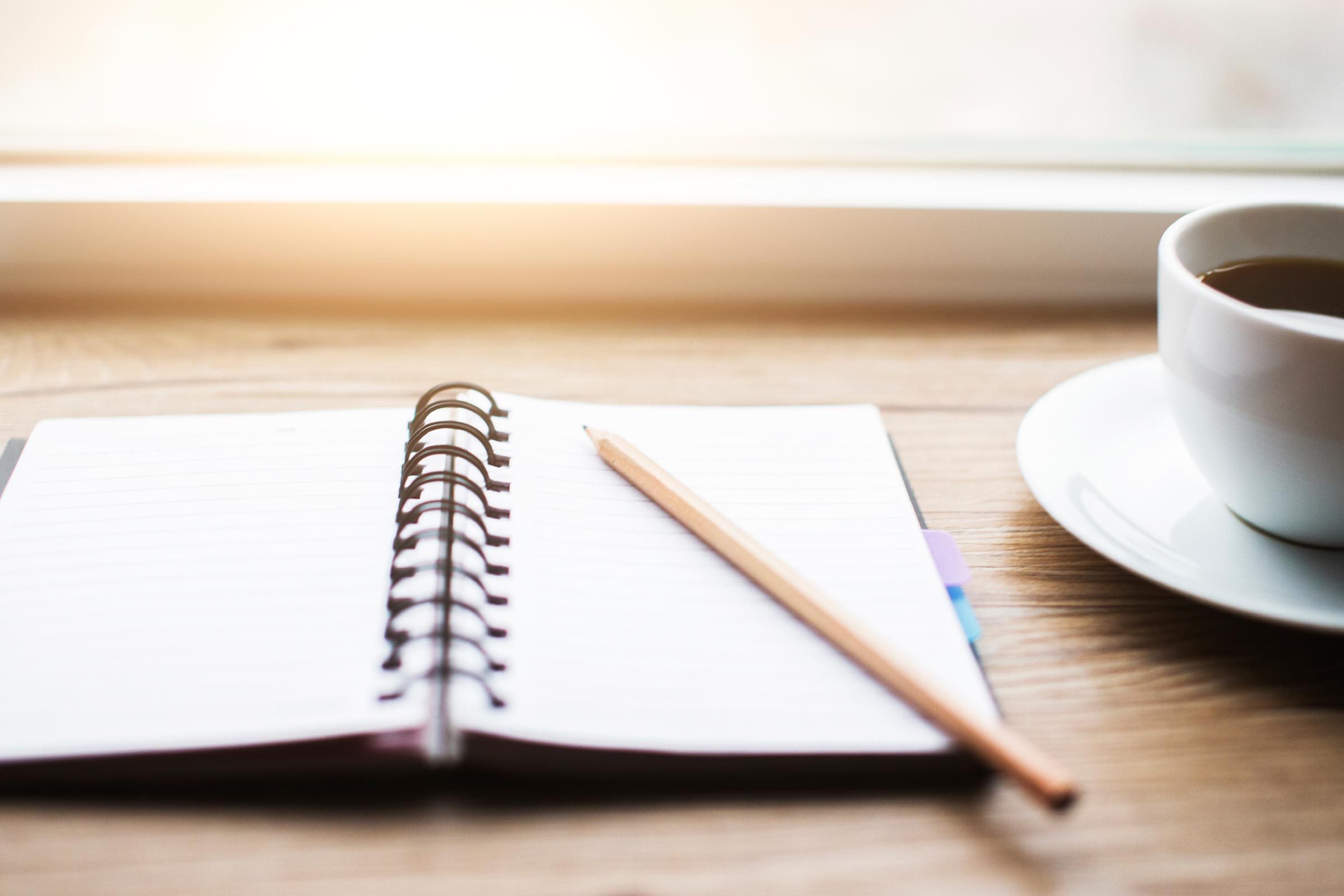 Coffee next to journal