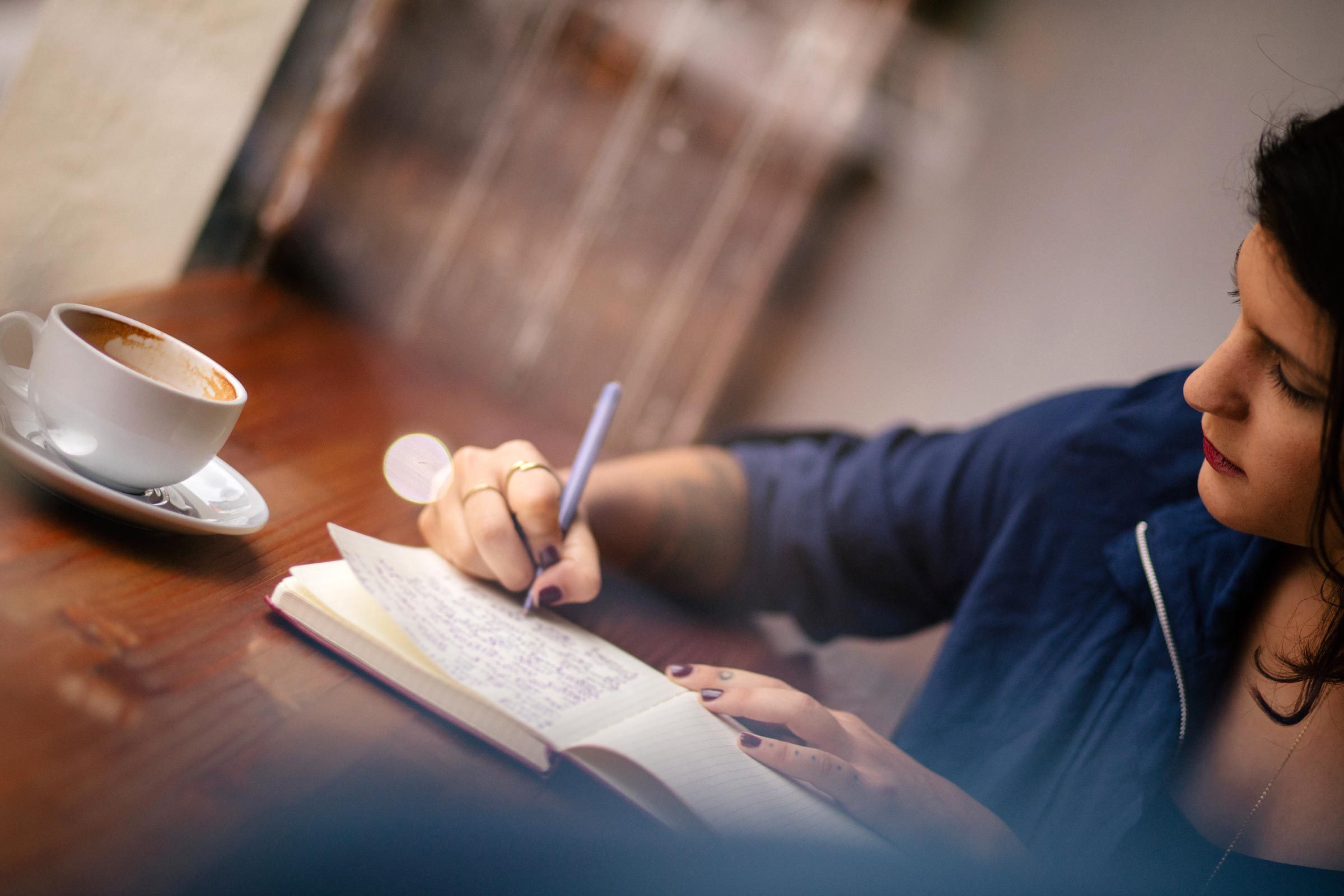 Woman writing in journal