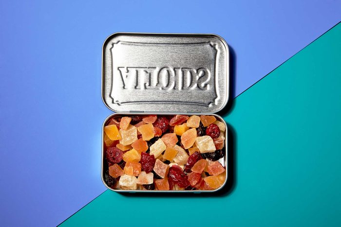 Illustration of portion control trick: dried fruit in a mint tin