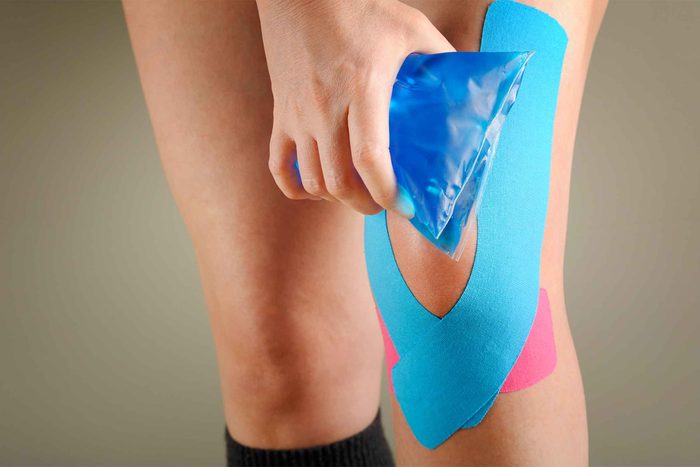 Person icing injured kneed