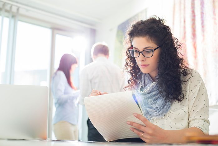 woman taking notes