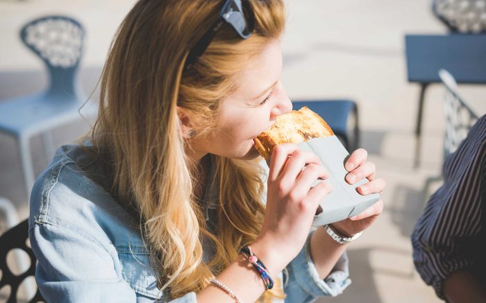 woman eating a sandwich