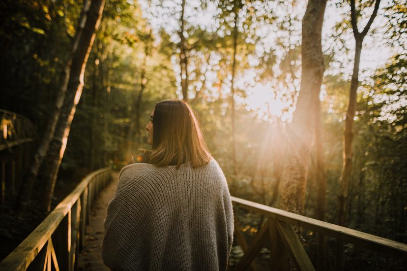 young woman being mindful on her walk