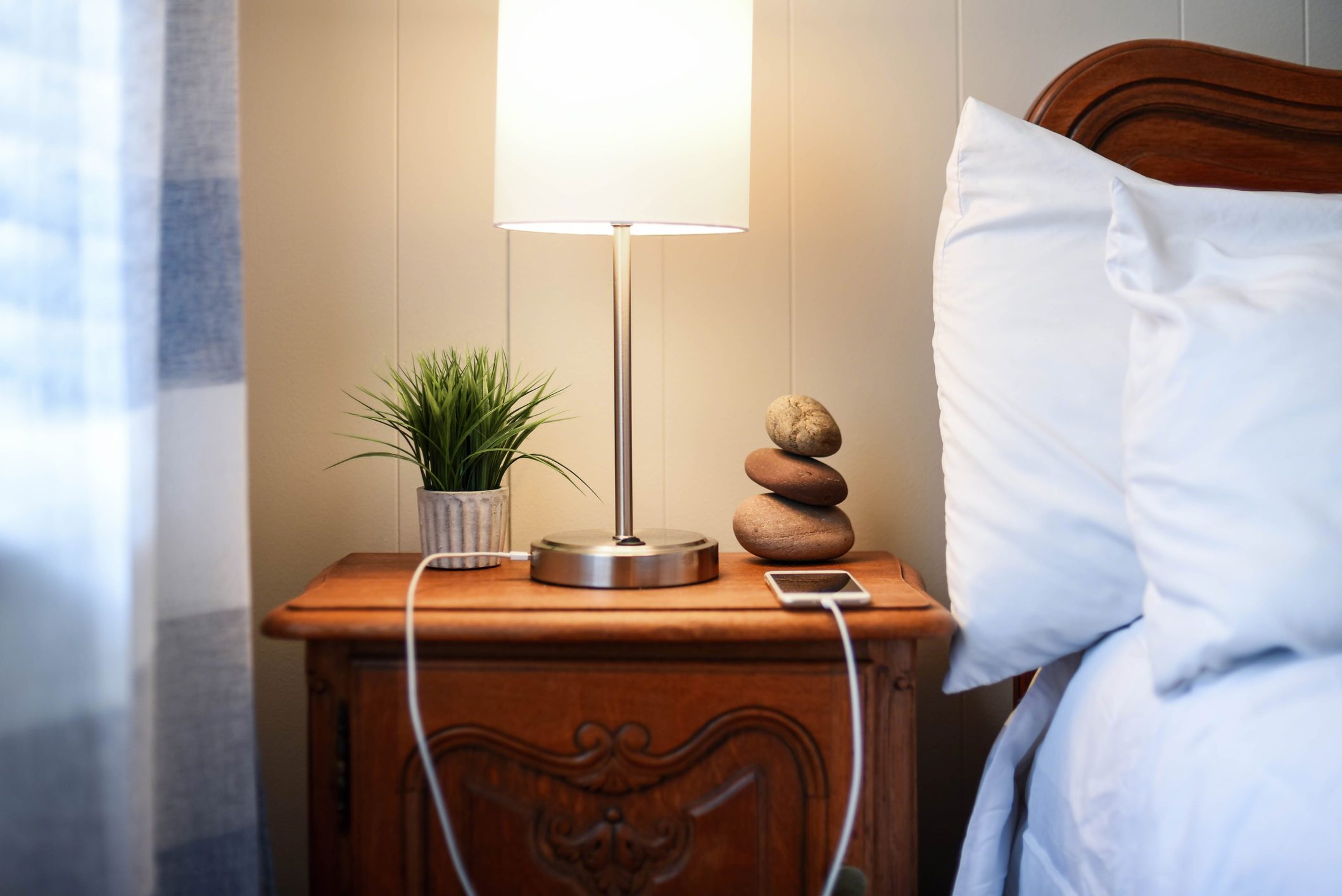 smarphone charging on nightstand