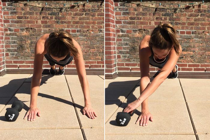 Woman doing alternating arm planks on the ground.