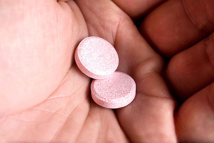 Hand holding antacids