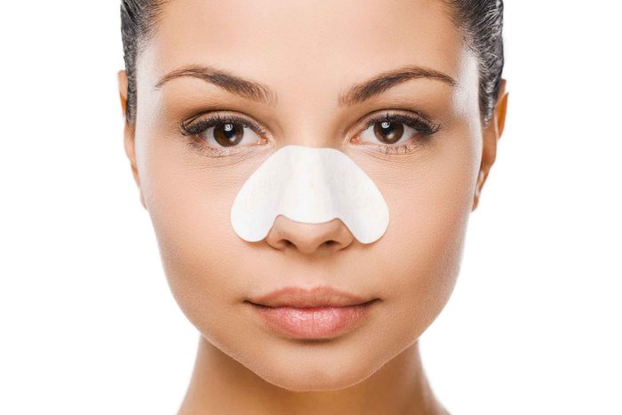 woman with nasal strip on nose