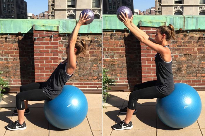 Woman doing a Swiss Ball with medicine ball throw.