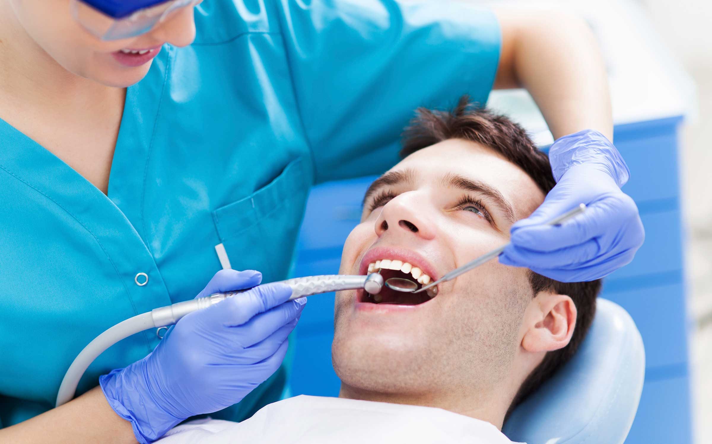 Man getting teeth cleaned