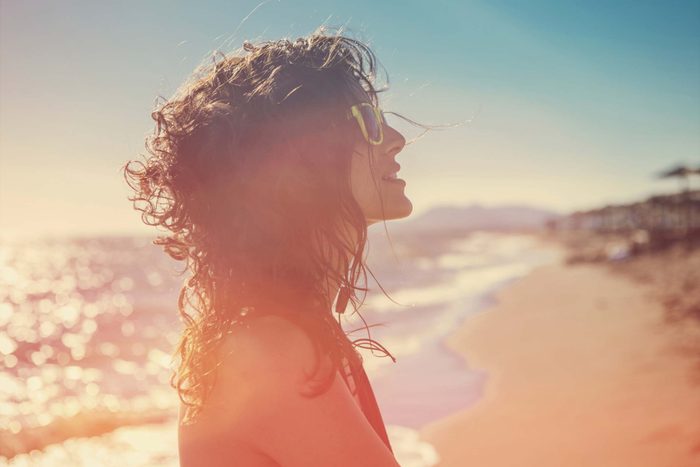 Woman on a sunny beach.