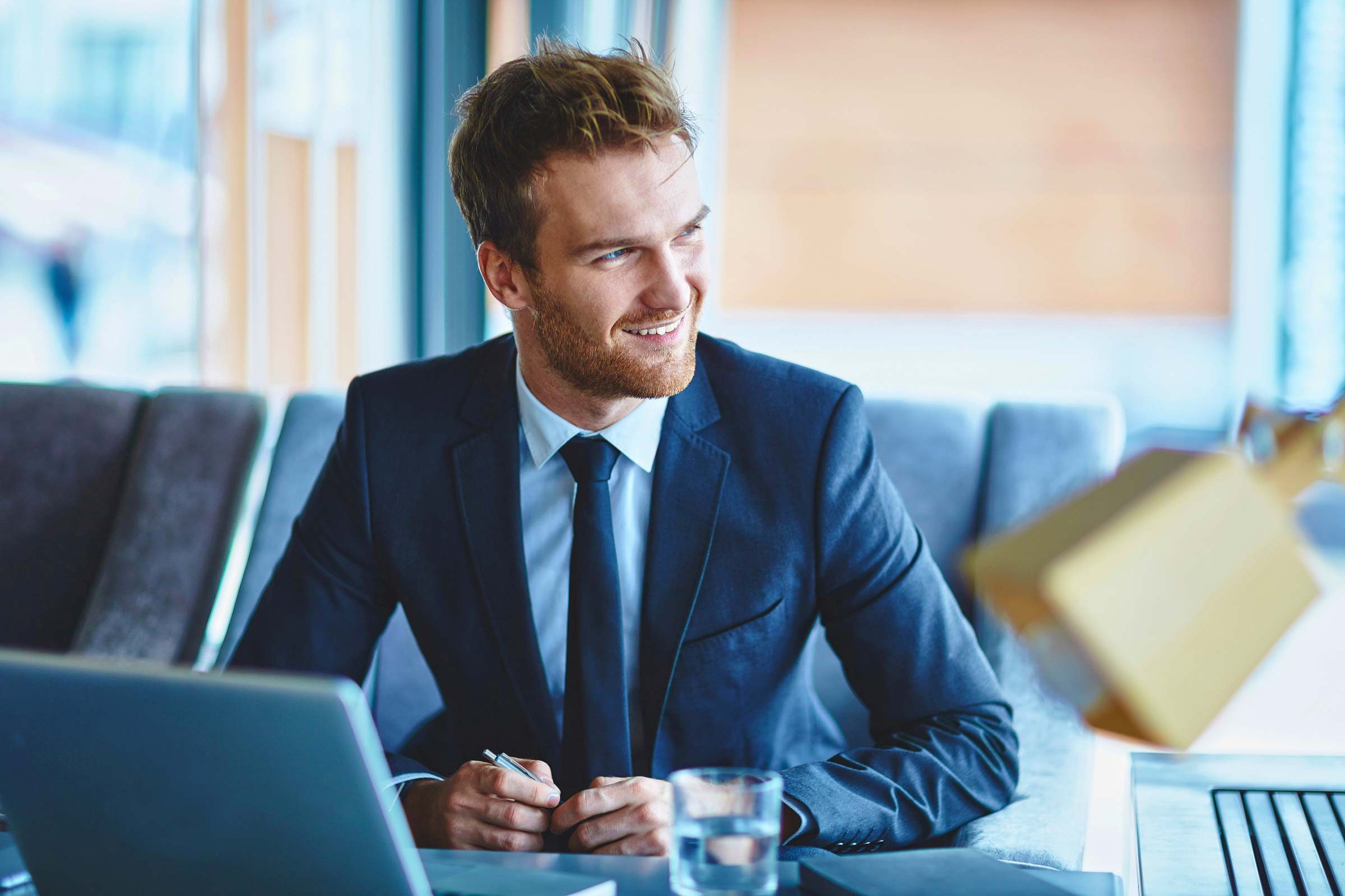 confident man with laptop