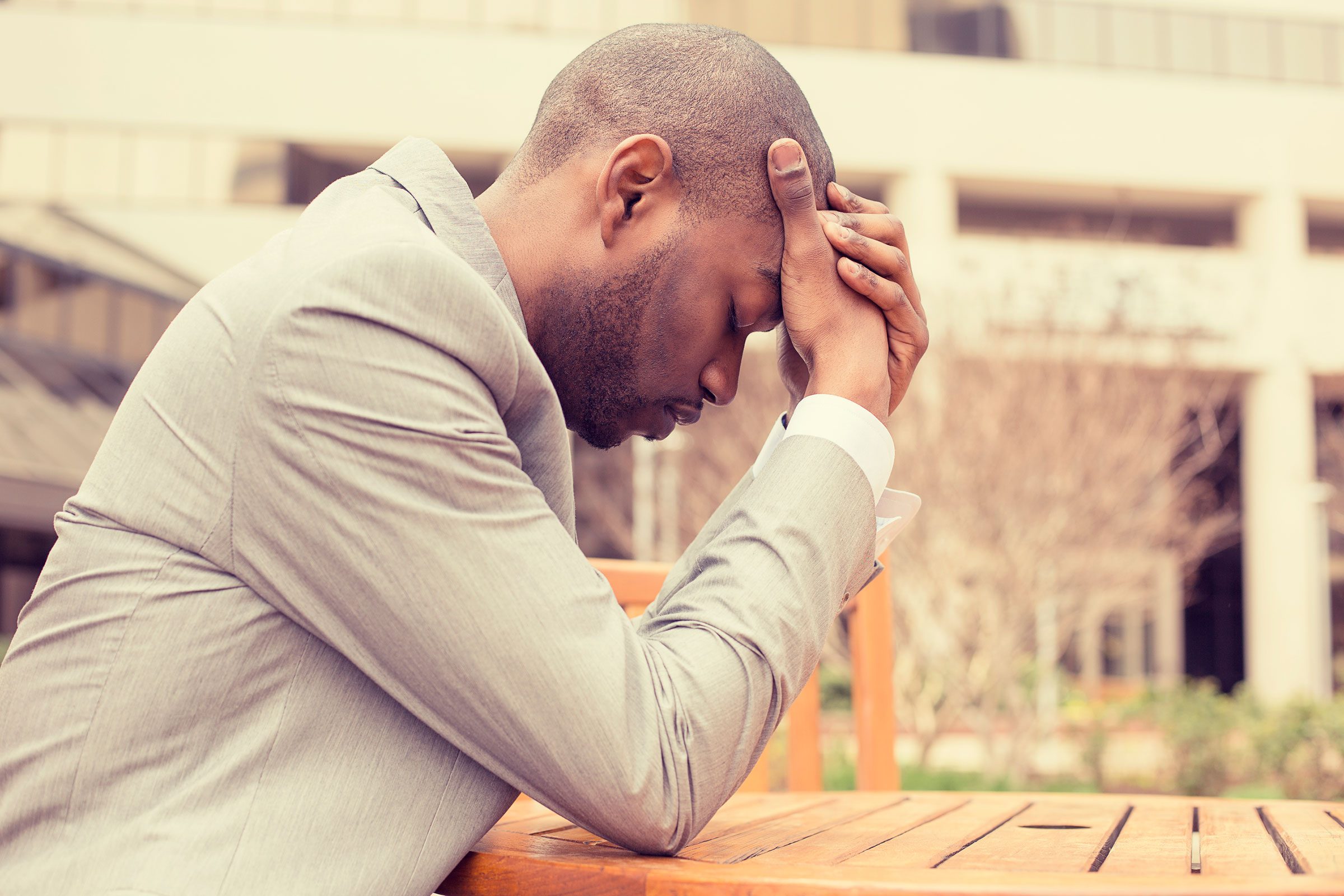 stressed man with hands on head
