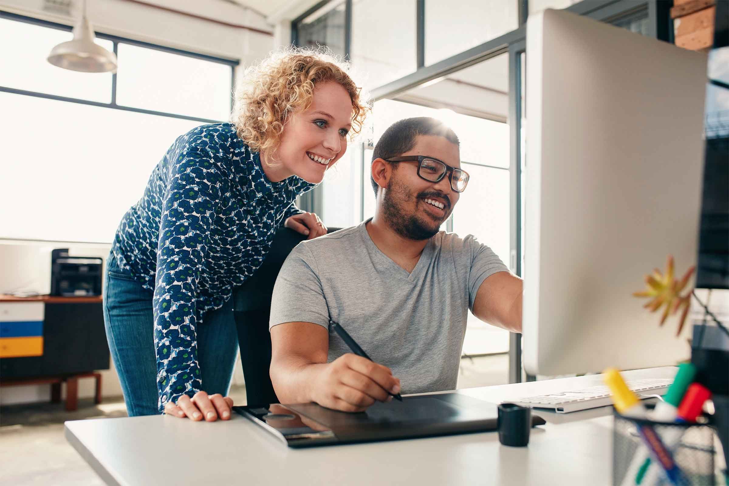 People looking at a computer together