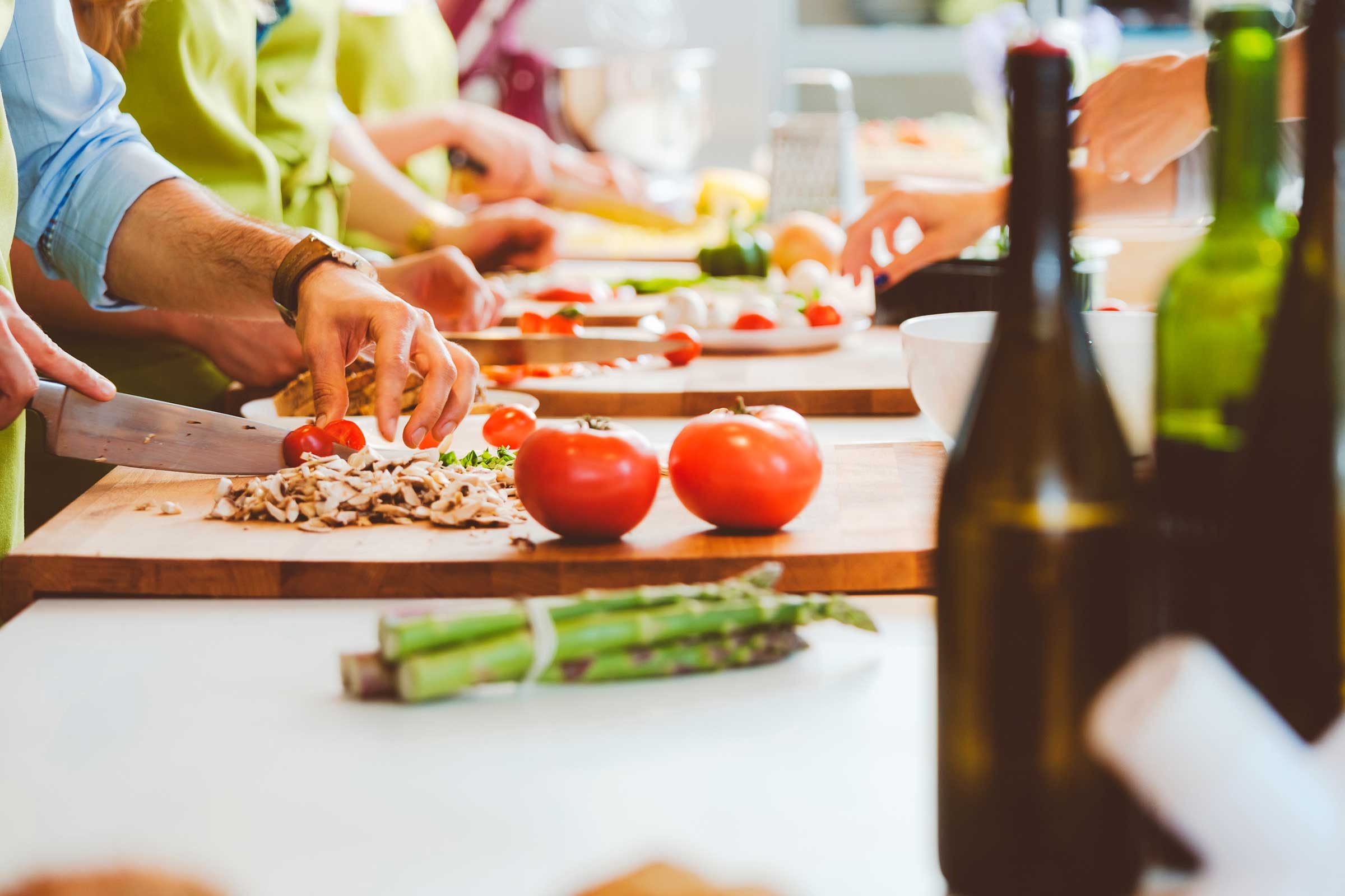 people preparing food on a counter