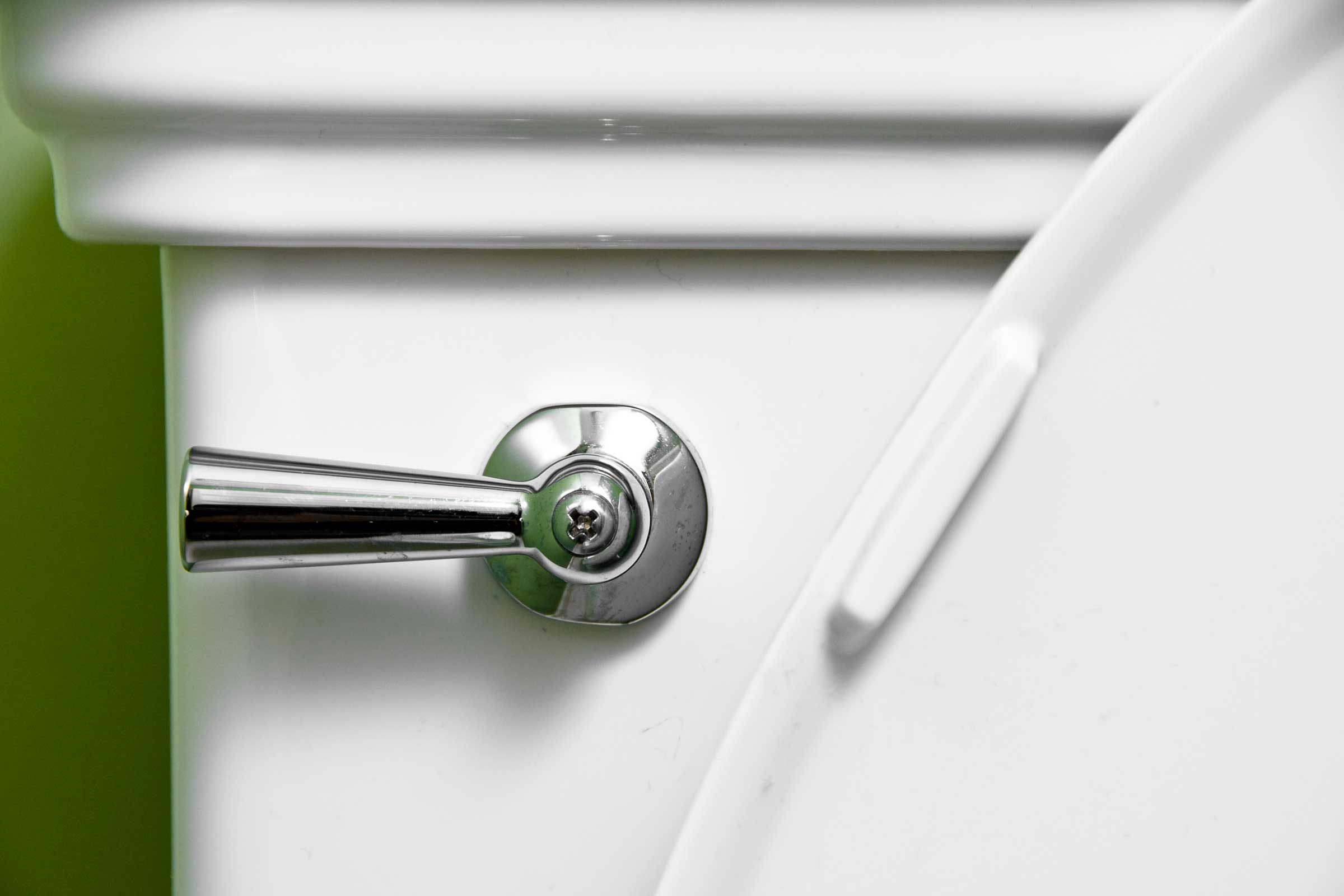 closeup of toilet flush handle