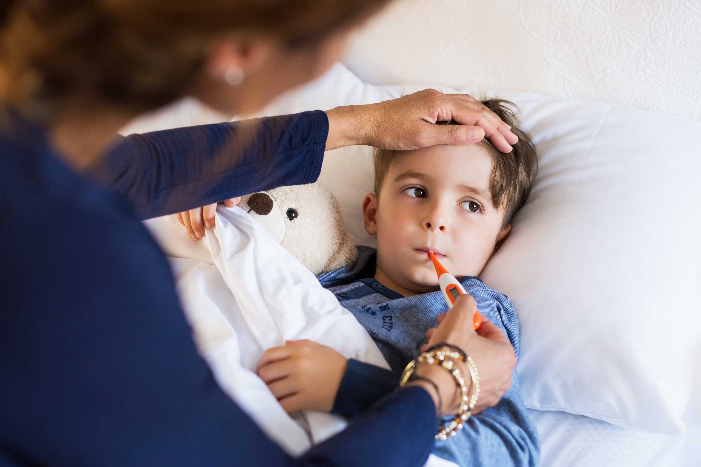 mother checking a child's temperature