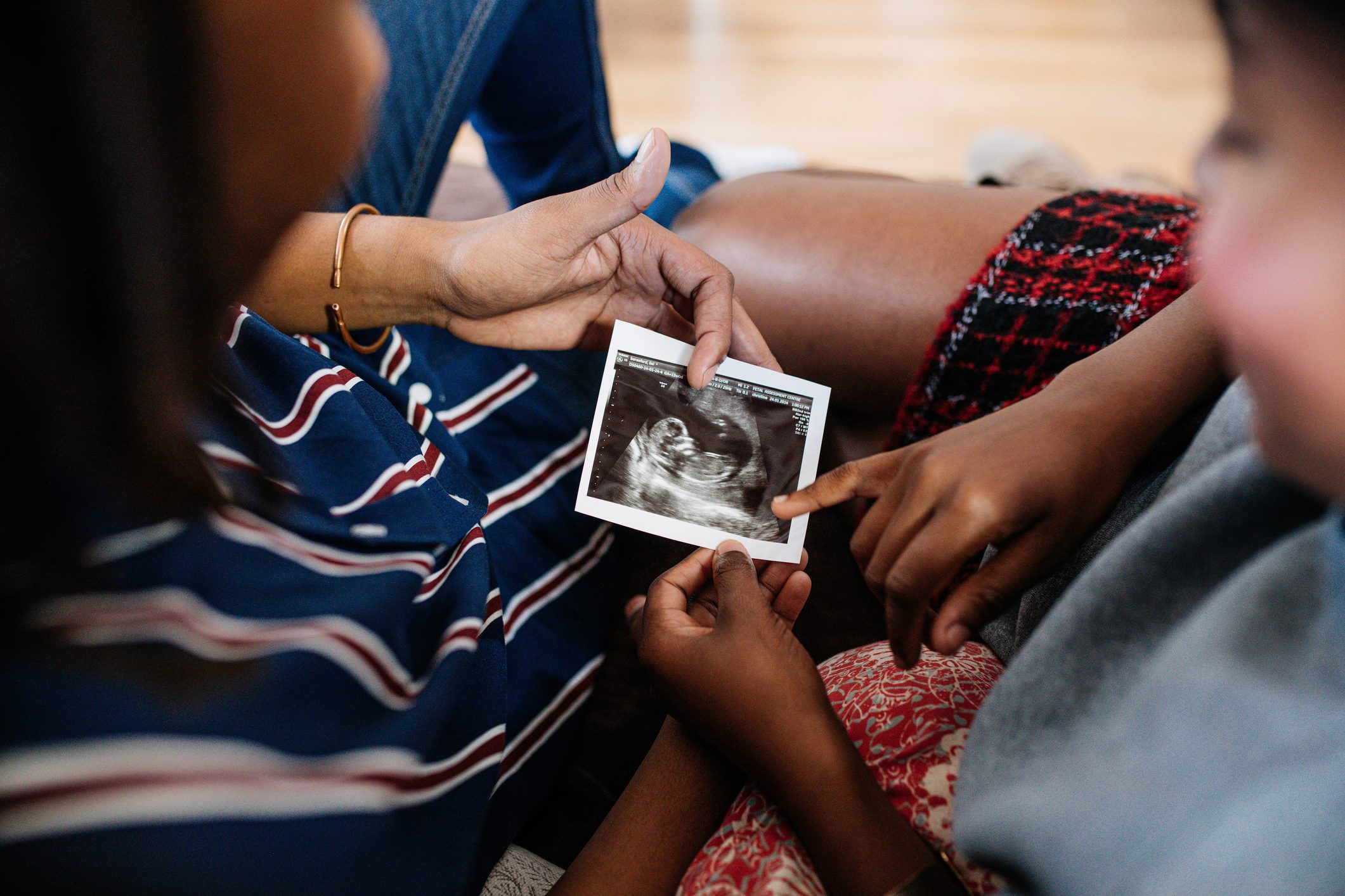 two people looking at ultrasound photo